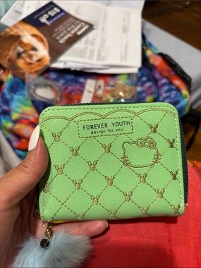 Green Quilted Zip Wallet with Pom Keychain.  Hello kitty